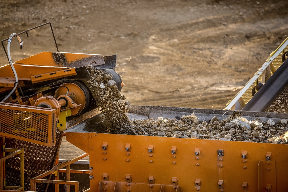 a machine processing concrete rubble